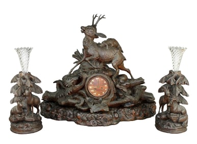 Black Forest mantel clock with carved deer and 2 matching vases