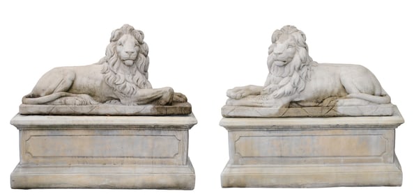 Pair Belgian cast garden laying lions on pedestals