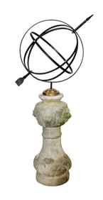 Garden armillary sundial in iron mounted on cast garden stone pedestal with lion heads