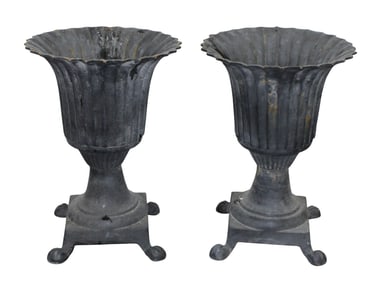 Pair of Neoclassical style fluted & flared iron urns on feet