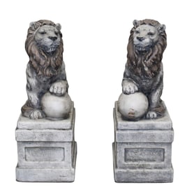 Pair cast garden seated lions with balls