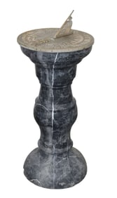 Bronze sundial on marble pedestal
