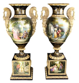 Pair of Louis XVI style painted urns on pedestal base with gilt swan handles