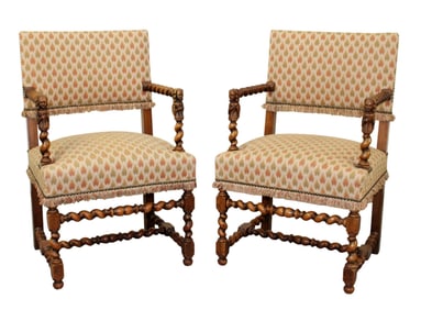Pair of French carved walnut armchairs with barley twist and figural arms
