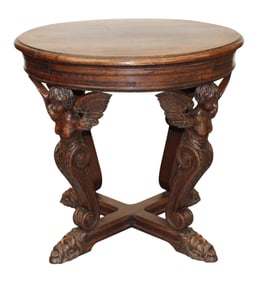French Baroque style gueridon table with cherub supports atop mythological masks