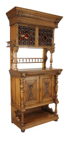 French carved oak buffet with stained glass upper doors and carved lion heads