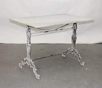 French café table with iron base and a marble top