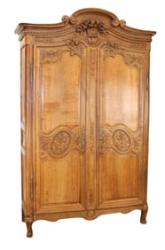French Normandy 2 door armoire in oak with carved pannier crest
