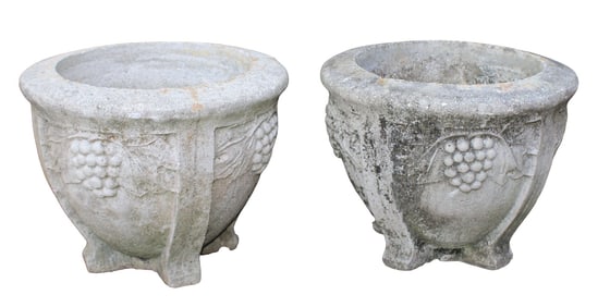 Pair of cast concrete garden urns with grapes