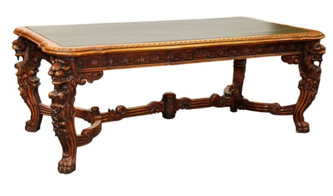Grand scale carved mahogany executive desk with leather top on carved lion form legs