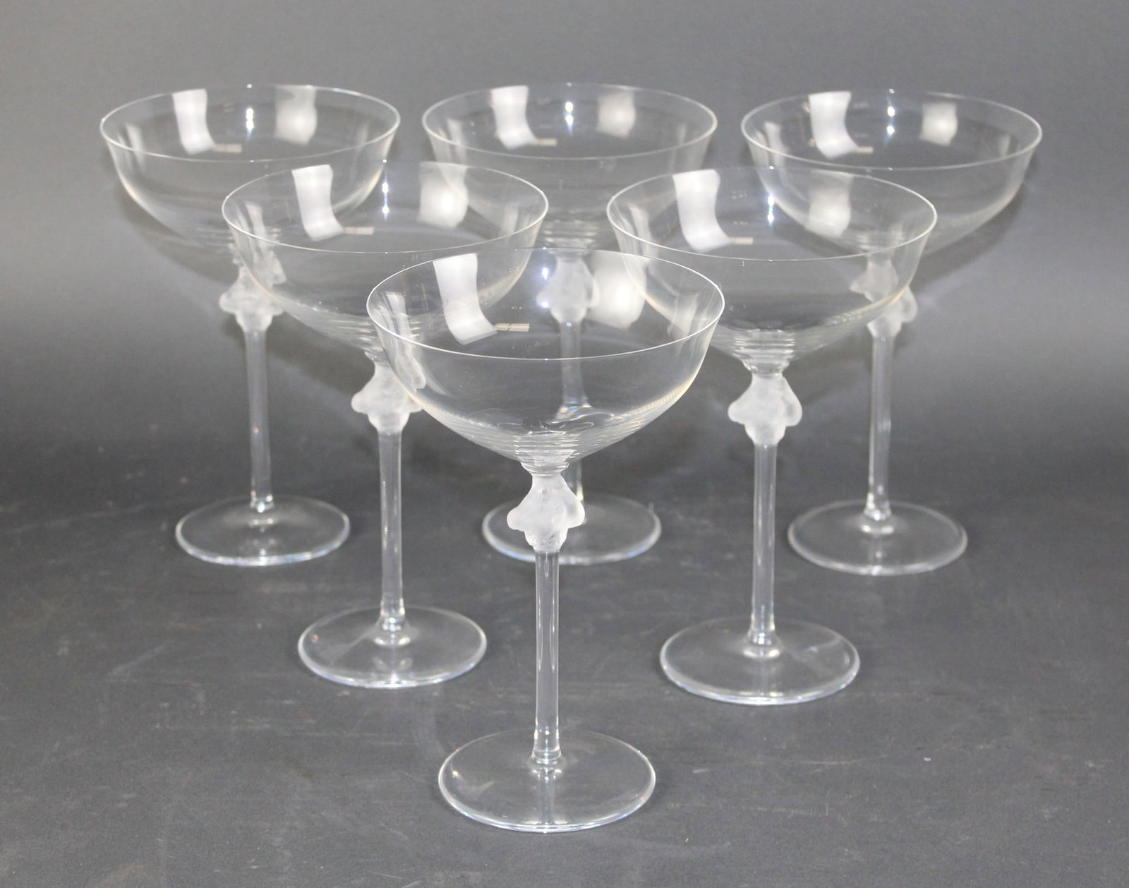 Set of 6 Lalique crystal Roxanne coupes: Set of 6 Lalique crystal Roxanne coupes. 6 3/4"h x 4 1/2" dia Weight: 1lb