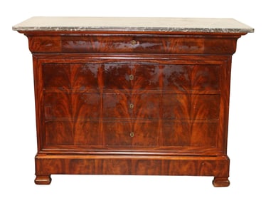 French Louis Philippe commode in flame mahogany with a marble top