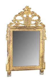 French Louis XVI giltwood mirror with acanthus flourish and ribbon