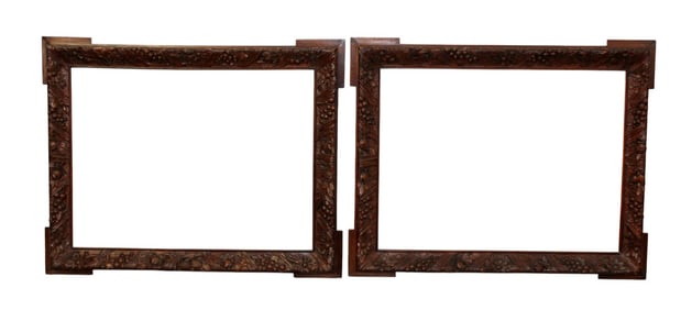 Pair of French relief carved oak frames with floral carvings