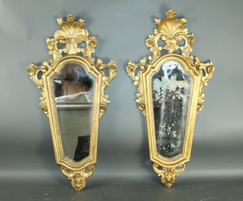Pair of Italian gilt wood mirrors with rocaille shell crests