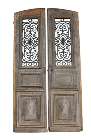Pair of French raised panel oak doors with iron panels