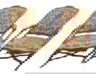 Pair of French Louis XV style armchairs in carved walnut with needlepoint upholstery: Pair of French Louis XV style armchairs in carved walnut with needlepoint upholstery. Each: 38 3/8"h x 26 1/2"w x 27"d, seat: 17 7/8"h