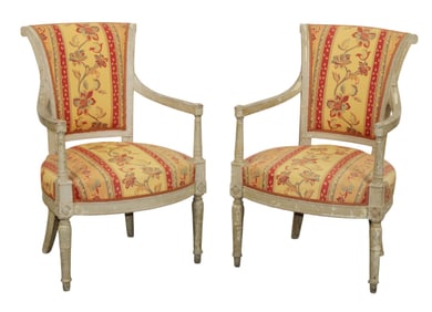 Pair of painted French Louis XVI style armchairs with floral upholstery