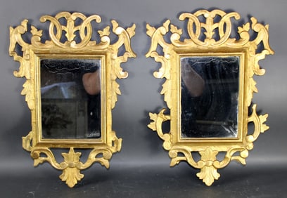 Companion pair of Italian Rococo gilt wood mirrors