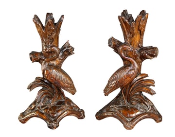 Pair of Black Forest candle holders with carved herons