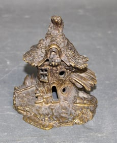 Miniature bronze matches holder with cottage