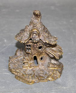 Miniature bronze matches holder with cottage: Miniature bronze matches holder with cottage. 4 1/4"h x 3 3/4"w x 4"d. Weight: 1lb