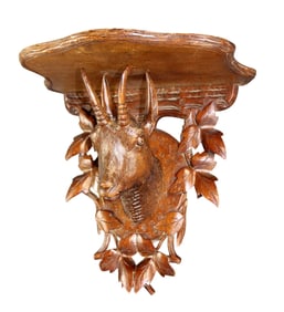 Black Forest relief carved wall shelf with antelope