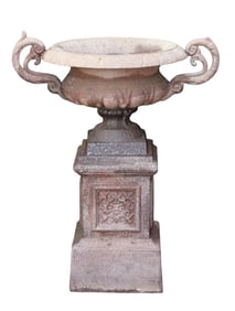 Single classical cast iron urn on pedestal