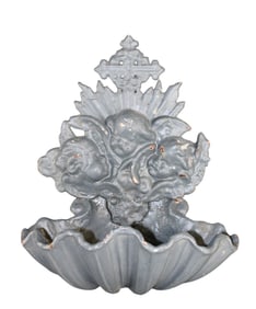 French cast iron wall fountain with relief cherubs