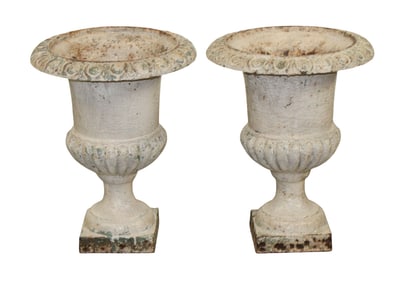 Pair of white painted iron fluted urns
