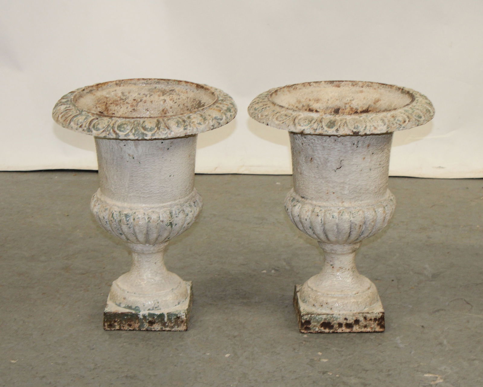 Pair of white painted iron fluted urns (1 of 6)