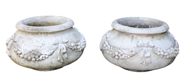 Pair of cast concrete garden urns with fruited garland