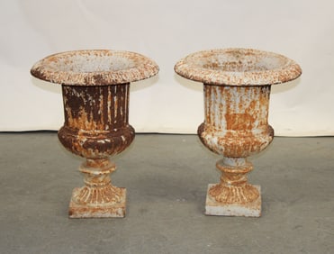 Pair of cast iron fluted garden urns