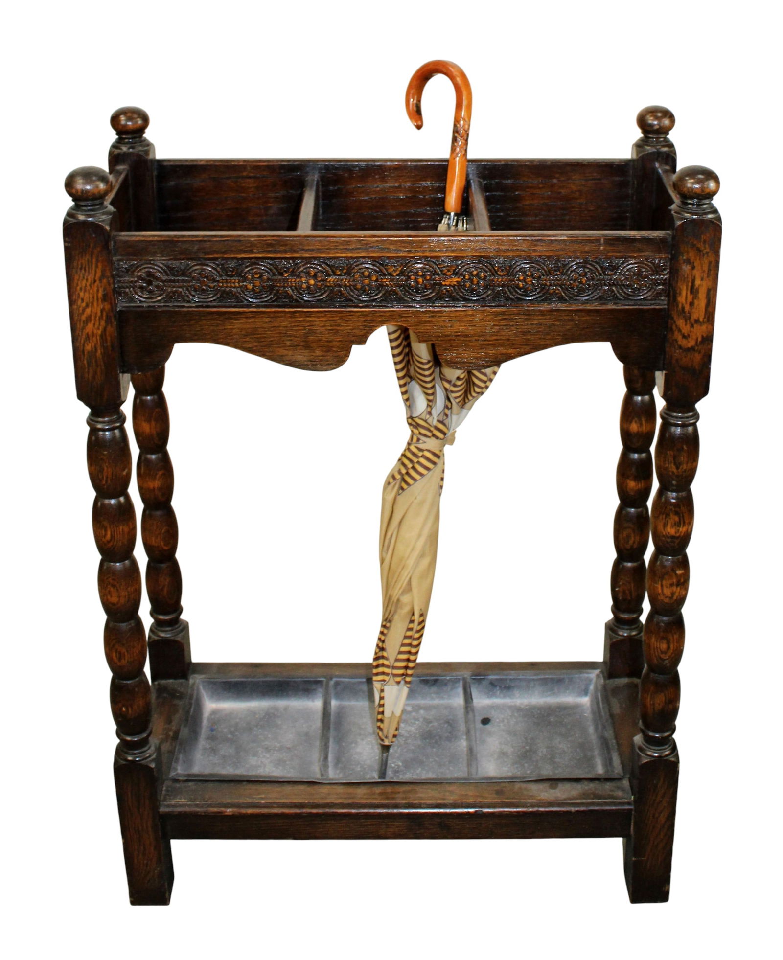 English oak bobbin leg umbrella stand: English oak bobbin leg umbrella stand. Early 20th century. 32 1/4"h x 23"w 10 1/2"