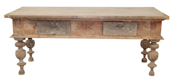 French Baroque style farmhouse table in walnut on carved legs with 2 drawers.