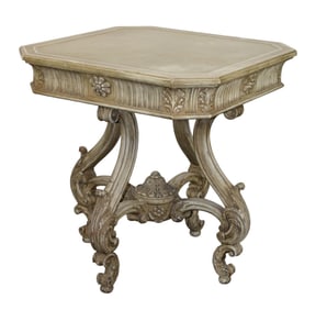 Italian center table on carved scrolled base with painted finish