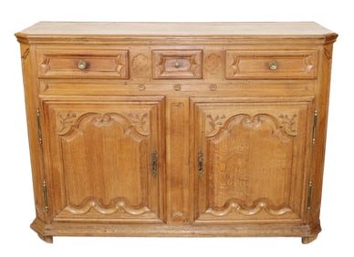 French Louis XV style buffet bas in oak with carved flowers