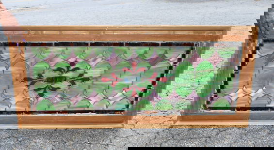 American stained and leaded glass transom window with stylized fleur de lys: American stained and leaded glass transom window with stylized fleur de lys. Early 20th century. Overall: 49"h x 22 1/4"w