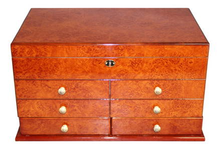 El Diablo cigar humidor with key in birds eye maple and Spanish cedar lining: El Diablo cigar humidor with key in birds eye maple and Spanish cedar lining. 10 1/4"h x 19"w x 11 5/8"d. Weight: 18lbs