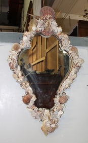 Shield form mirror encrusted with shells