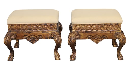 Pair of gilt wood stools with paw feet