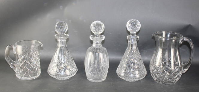 Lot of 3 Waterford crystal decanters and 2 pitchers: Lot of 3 Waterford crystal decanters and 2 pitchers. Decanters measure 11"h and pitchers measure 8"h x 8 1/2"w and 6 1/4"h x 7"w. Weight: 15lbs
