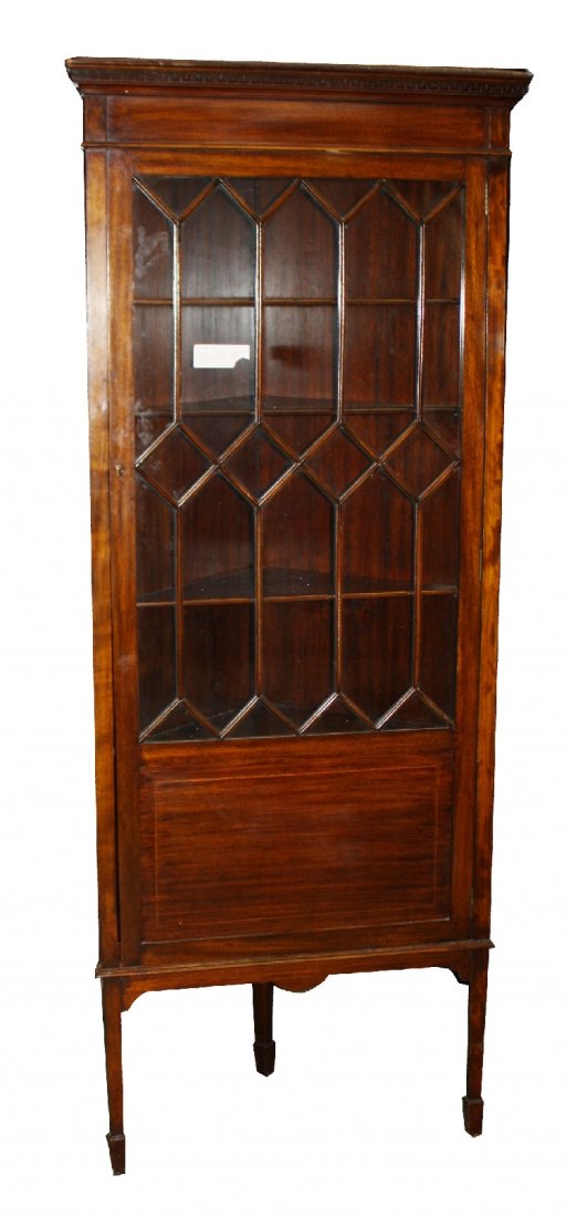 Edwardian corner cabinet in mahogany on tapered legs: with individually paned glass doors. 72 3/8"h x 29 3/8"w x 21 1/8"d