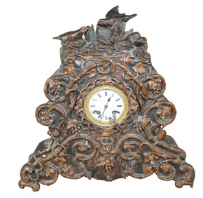 Black Forest carved walnut mantel clock with birds