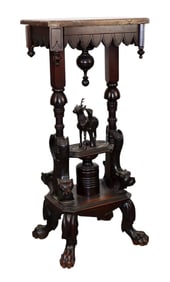 German side table with deer carving and marble top on paw feet