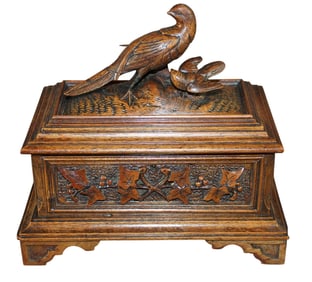 Miniature Black Forest carved walnut dresser box with birds