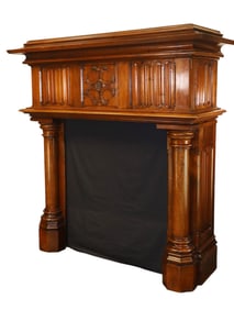 French Gothic Revival carved walnut mantel with columns and rosette on frieze and marble top