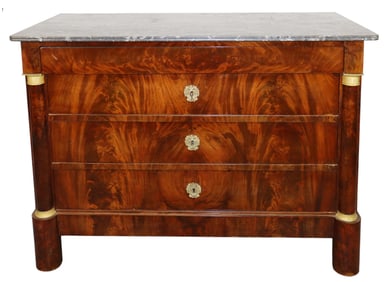 French Empire commode in flame mahogany with marble top