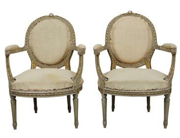 Pair of French Louis XVI style painted and parcel gilt balloon back armchairs