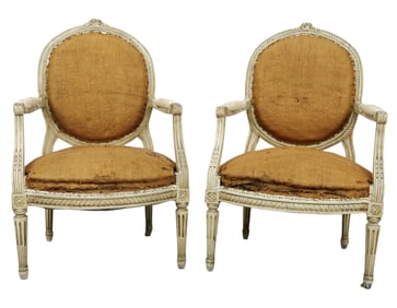 Pair of French Louis XVI style balloon back armchairs in painted finish on fluted legs
